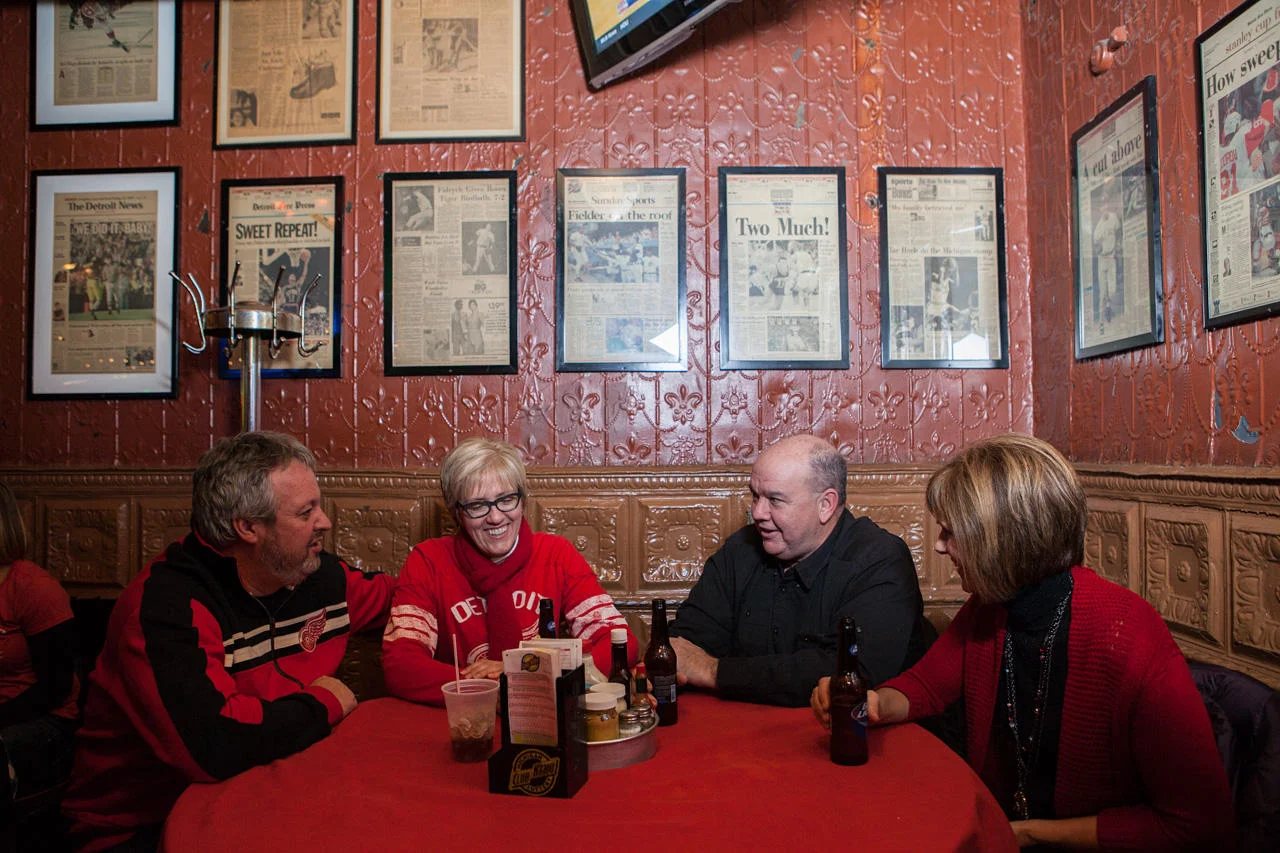 A group of friends shares an after-game drink at Nemo’s in Corktown.