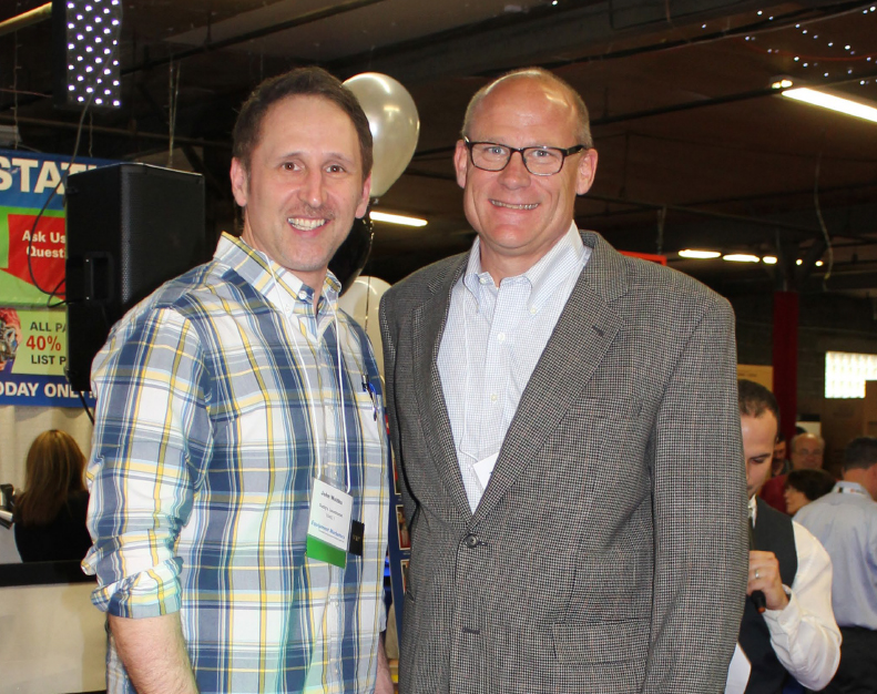 Winner of one of the grand prize washing machines with Tim Sullivan, Senior Sales Manager Commercial Laundry, Maytag - Whirlpool
