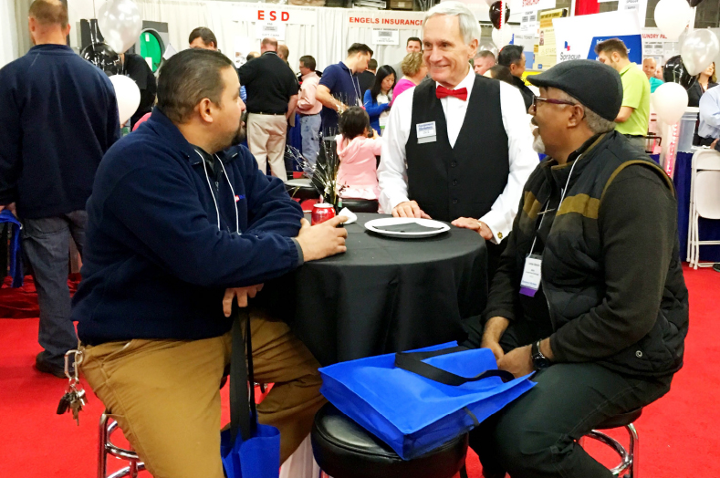 Dick Lamaina, President of Equipment Marketers, speaking with customers.