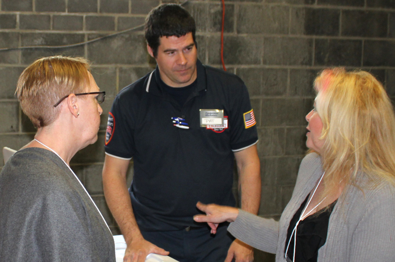 Serrvice technician Pat Hagan answering customers question regarding customer service at Equipment Marketers.