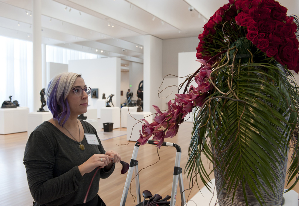 Heather Miller of Eclectic Sage finishing up her piece for Art in Bloom