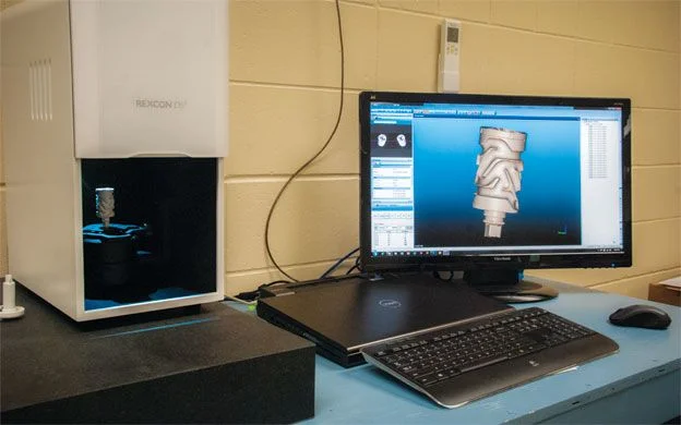 RollEase Innovation Center in Brunswick uses a 3-D scanner to create a CAD blueprint used in making parts for window coverings.