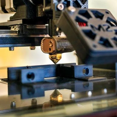 The MakerGear M2 3D printer prints a component for a lock in Patric Santerre’s architect and industrial designer of ARCADIA designworks, Portland Studio.