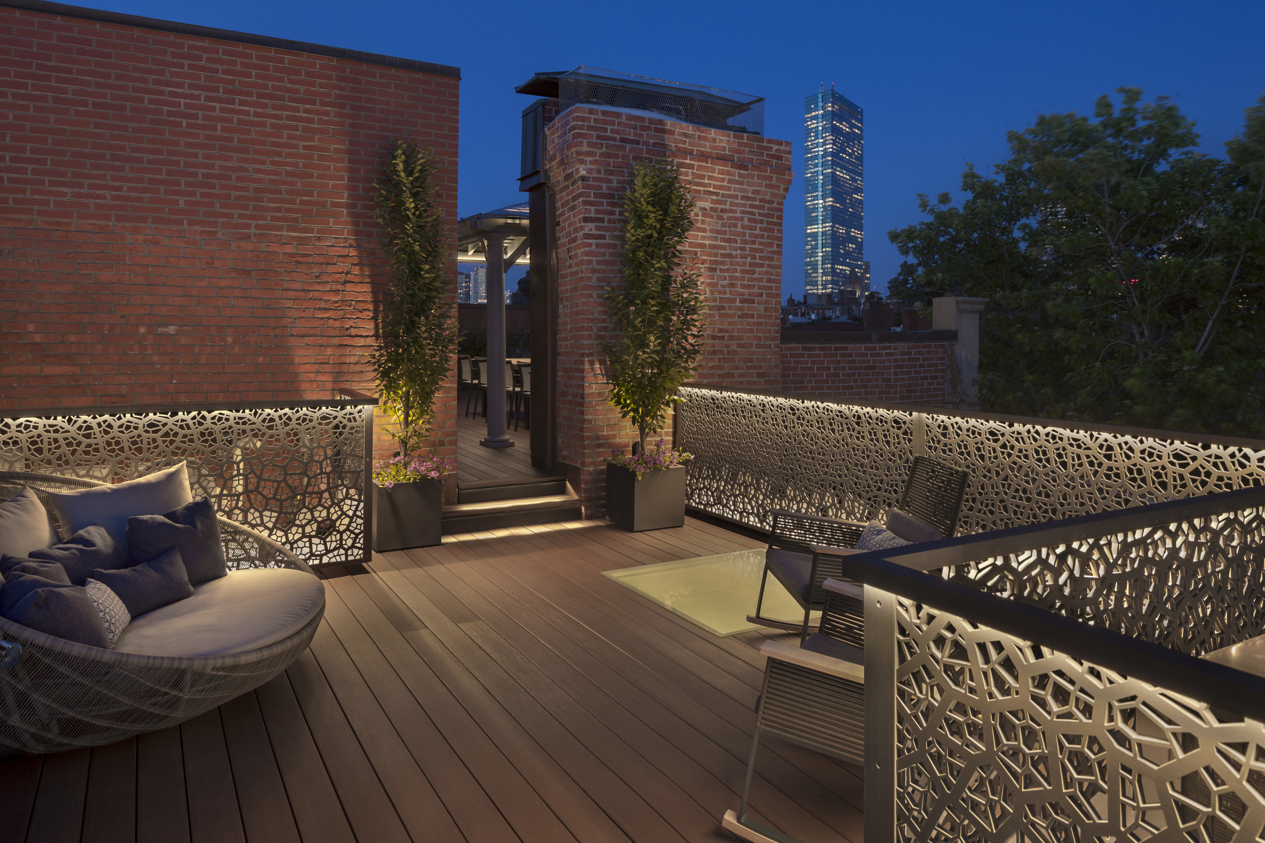  The railings help screen roof utilities and define this seating area. 