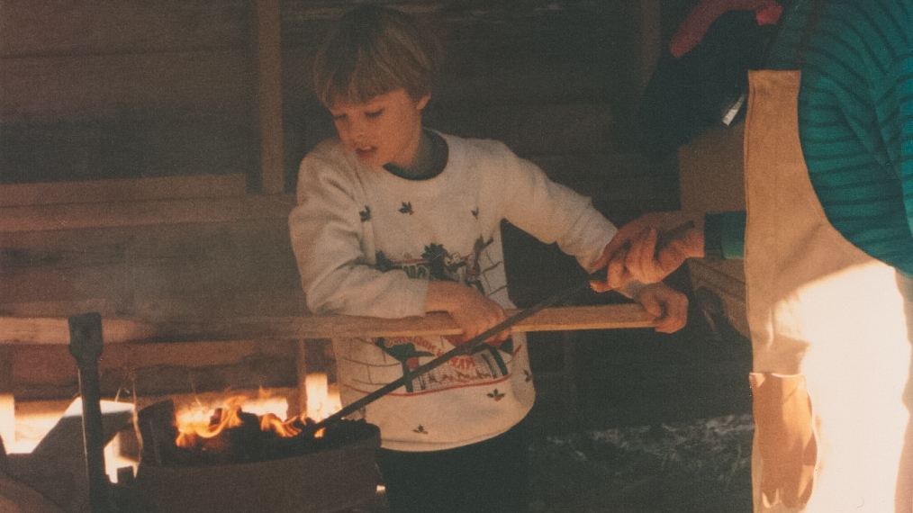  Jacob pumping the bellows of the coal forge for his older brother. 