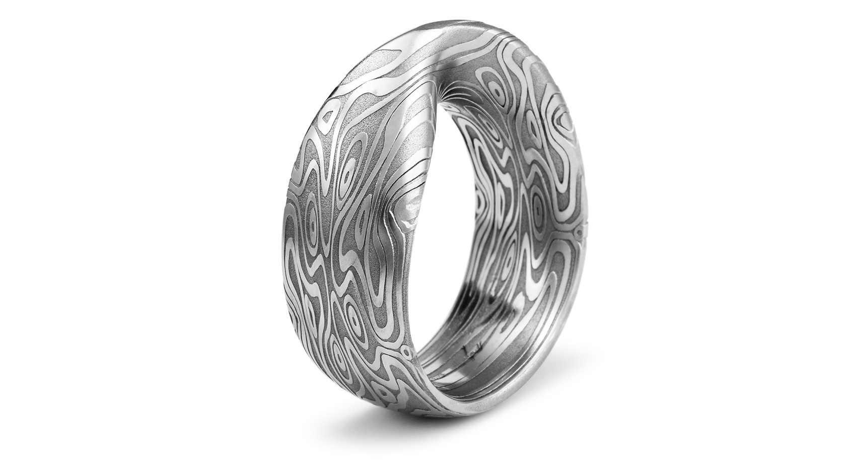  A seamless möbius strip ring custom carved from our Damascus. 