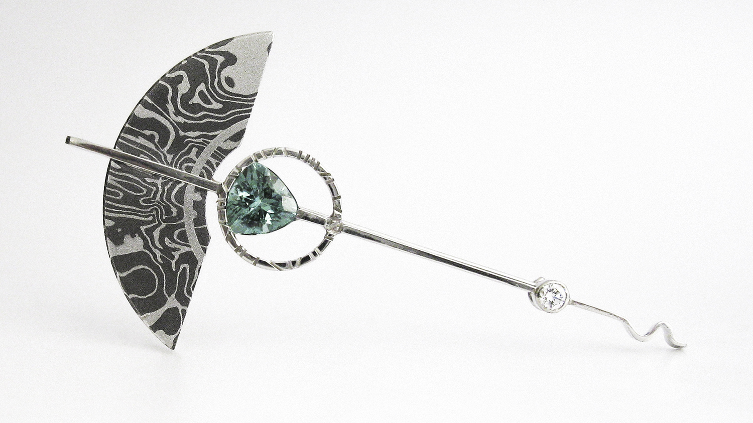  A brooch made from experimental Tantalum and Platinum Mokume Gane. 