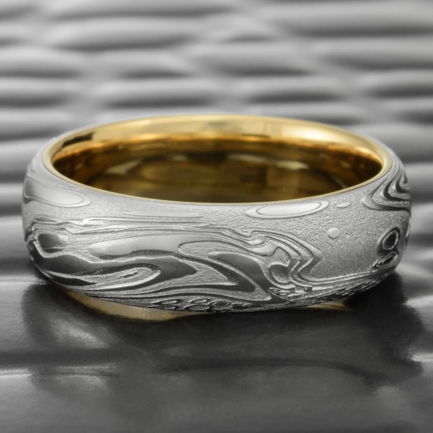 alternative domed gold steel ring unique