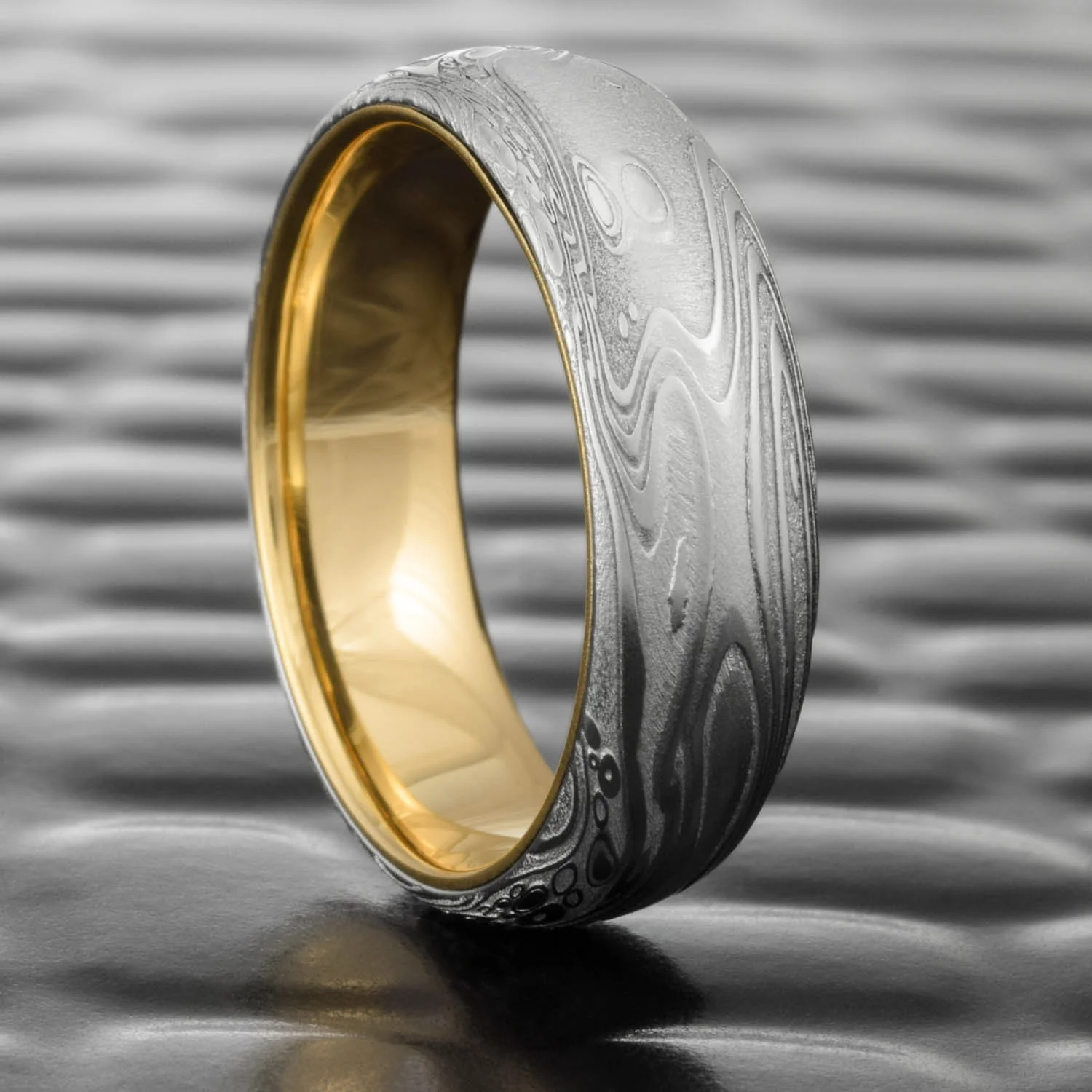 gold lined steel patterned damascus wedding band womens