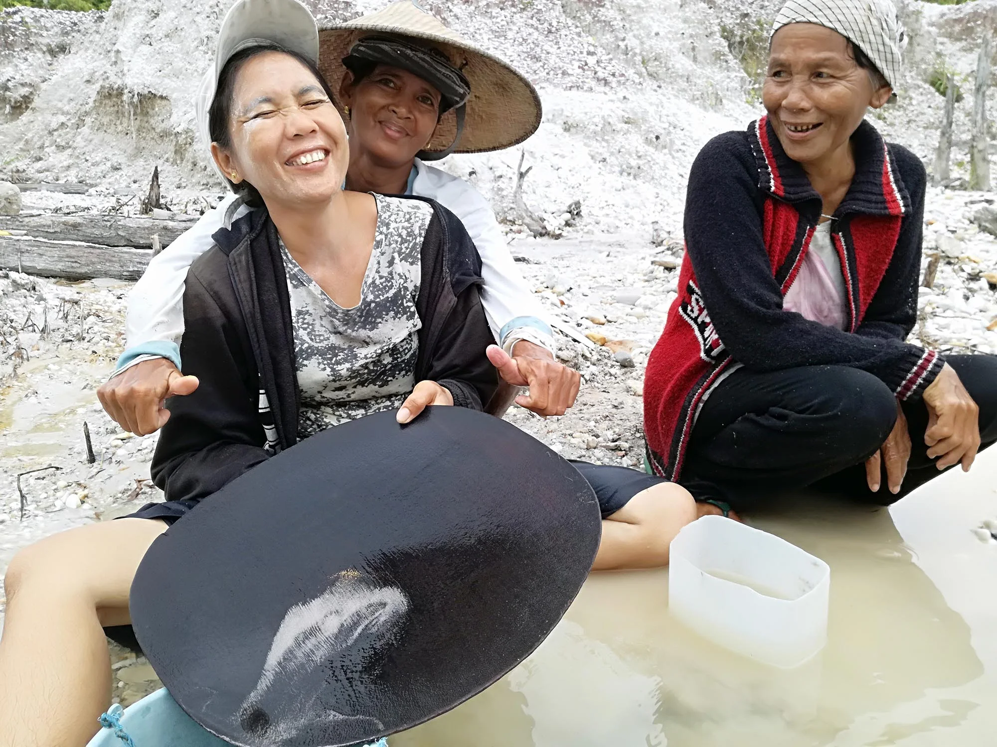 Women miners in Indonesia using traditional mining methods.