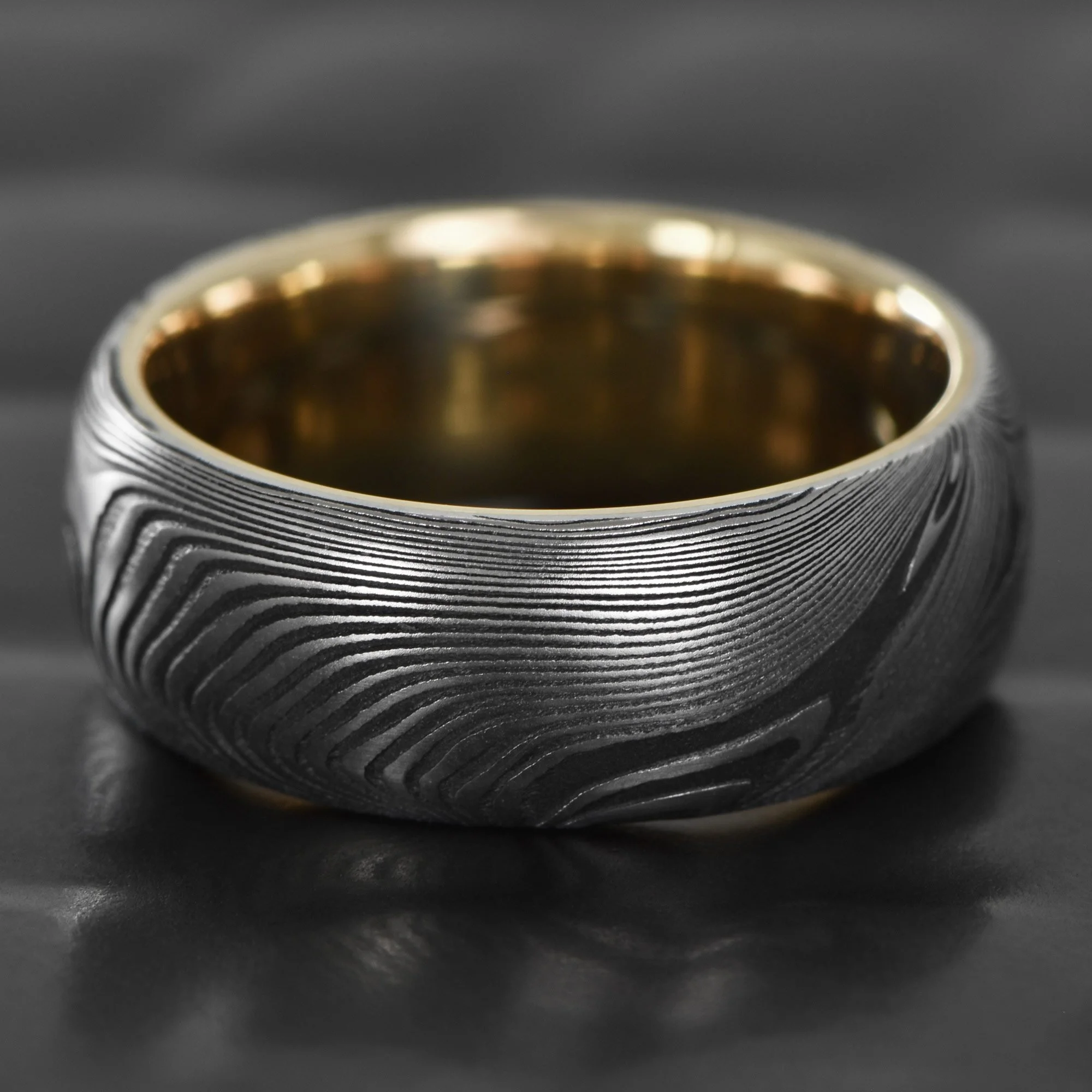 Old-Growth-Damascus-Steel-Wedding-Ring-14K-Gold-Sleeve.jpg