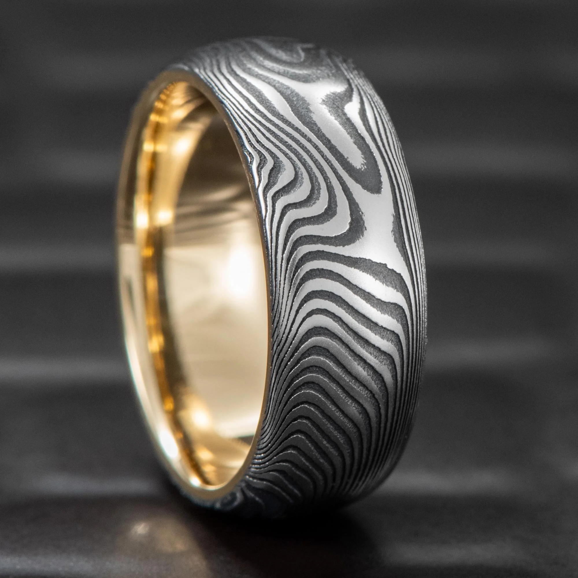 Damascus-Steel-Wedding-Ring-Domed-Gold-Sleeve-Old-Growth.jpg