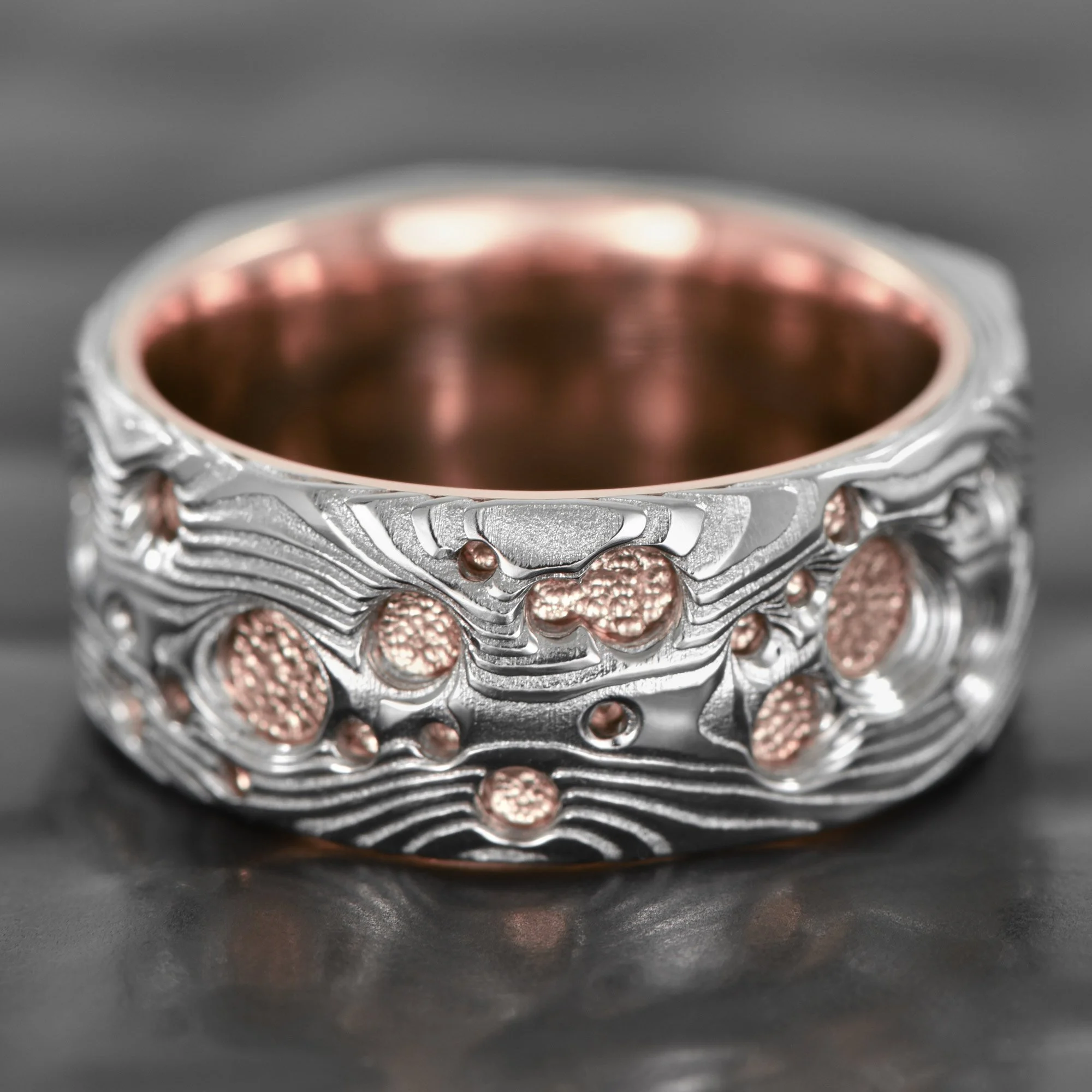 Hand-Carved-Damsacus-Steel-Ring-Crater-14K-Rose-Gold-Liner.jpg