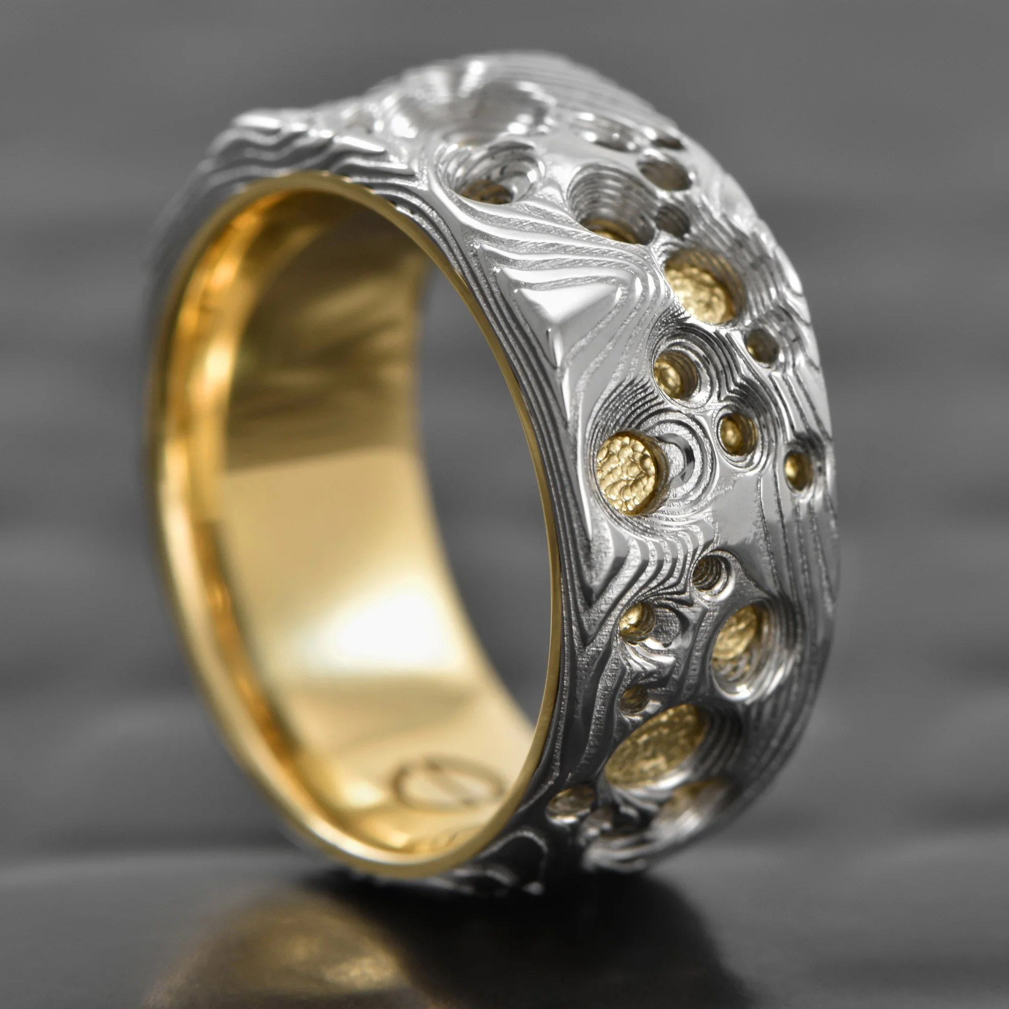 Damsacus-Steel-Ring-Carved-Crater-18K-Yellow-Gold-Liner.jpg