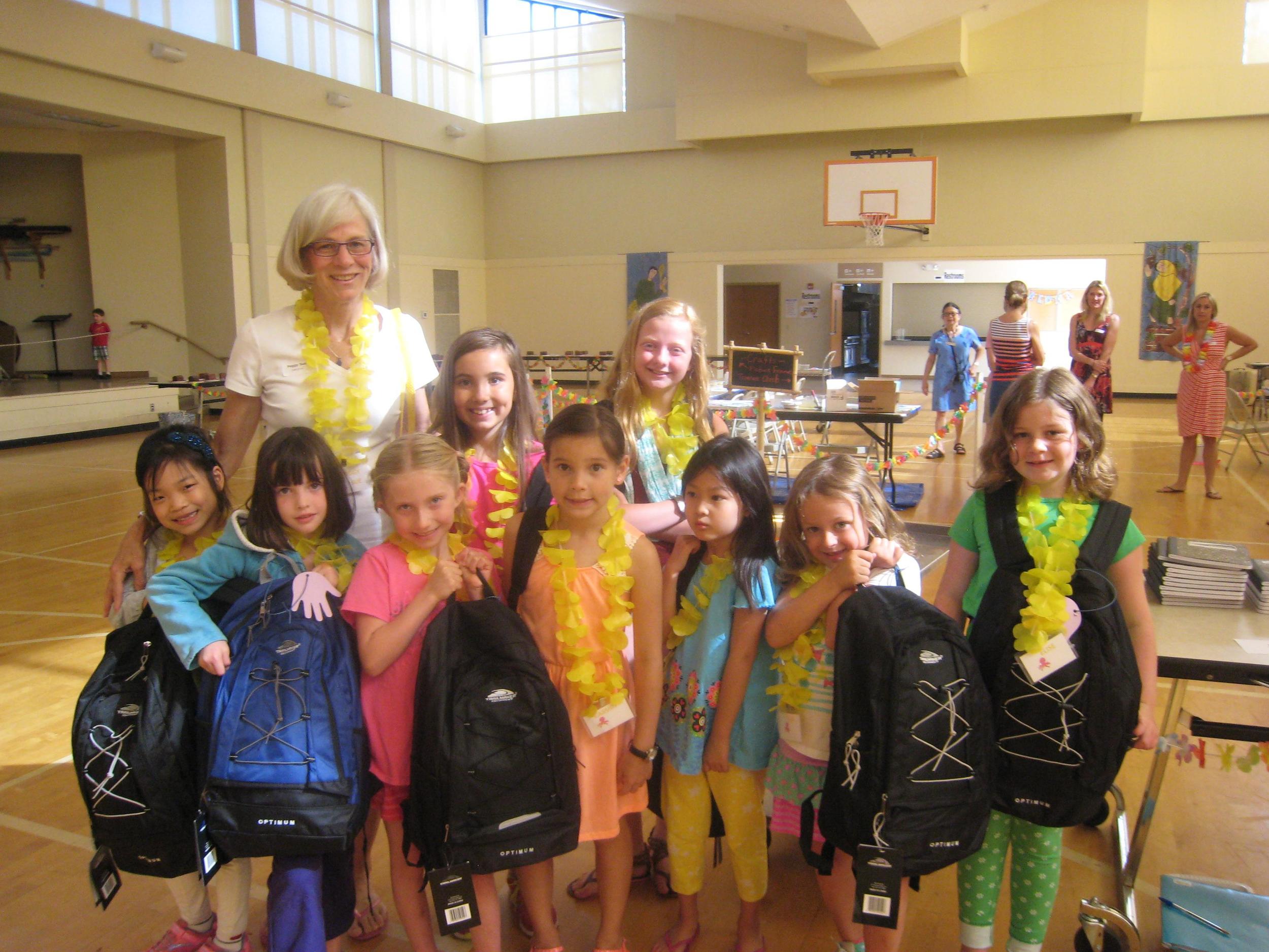 Peggy Sue Juergens and her VBS team finish filling backpacks for MIPC's mission partner.
