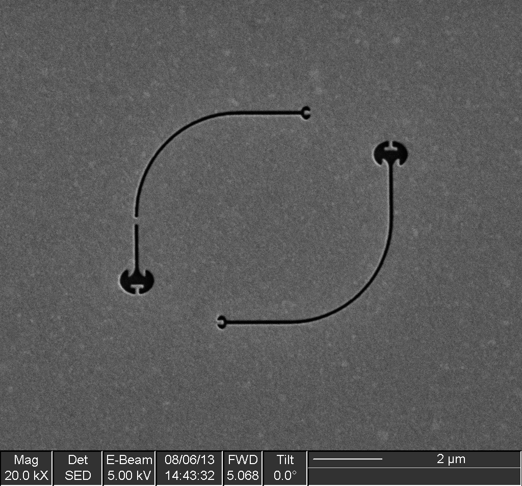 SEM of two waveguides. The one on the left has an intentional blockage. The one on the right in unobstructed.