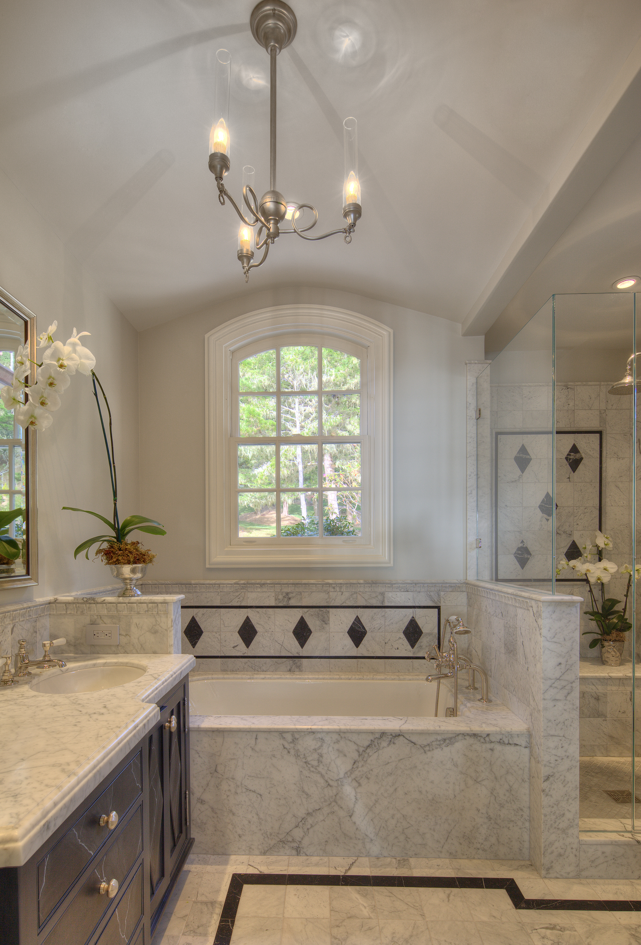 marble bath window and custom tile floor
