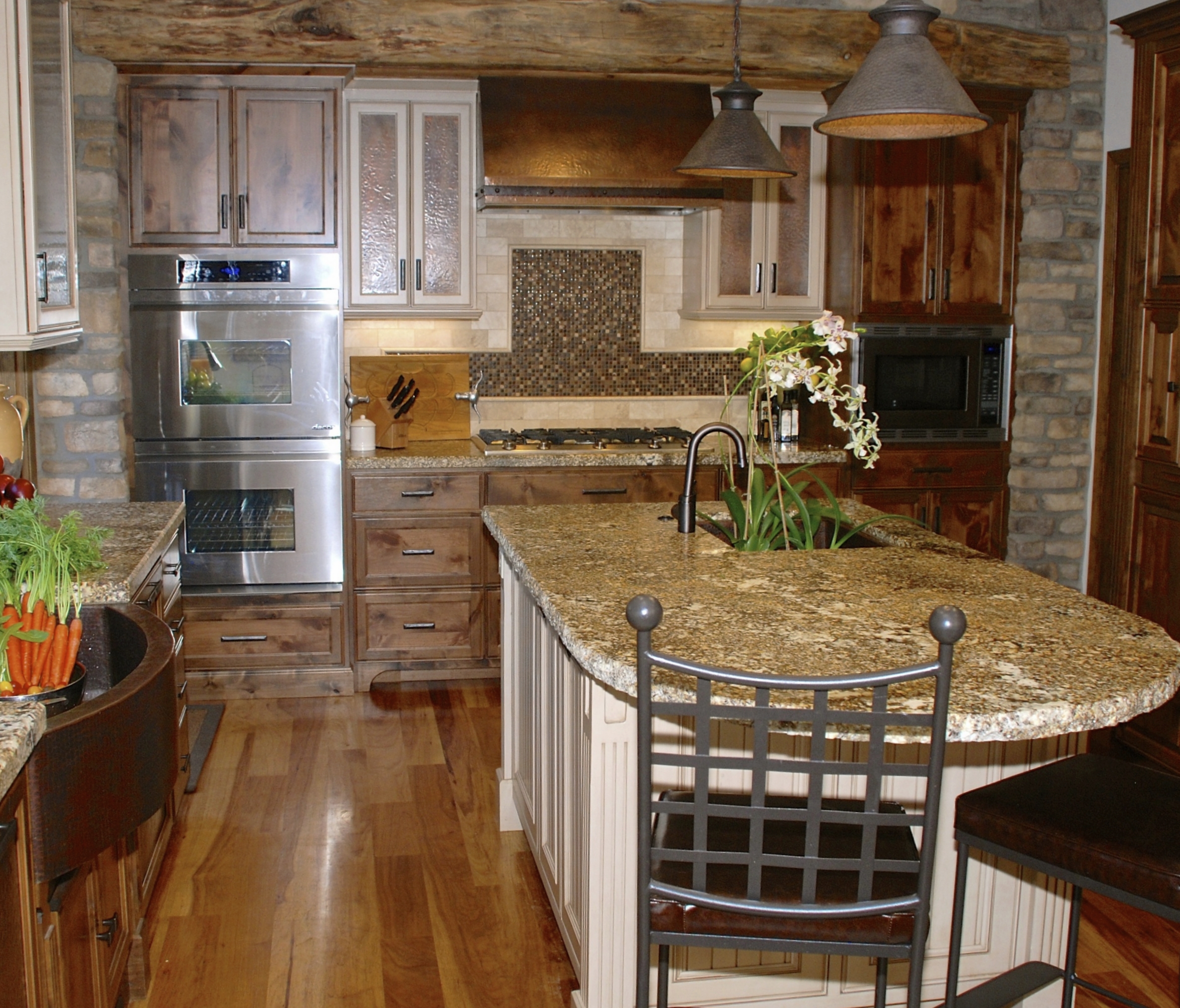 wood floor and stone wall kitchen