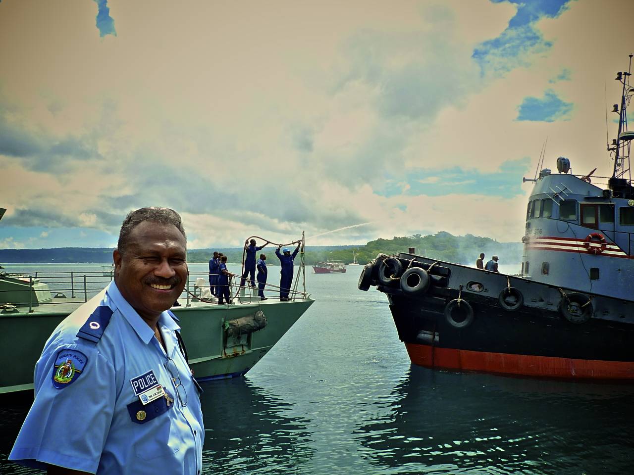 head of the maritime police (and head of surveillance of fisheries operation as well) taking control on the situation... behind the patrol boat crew helping (and giving the crew of the boat in problem a shower).jpg