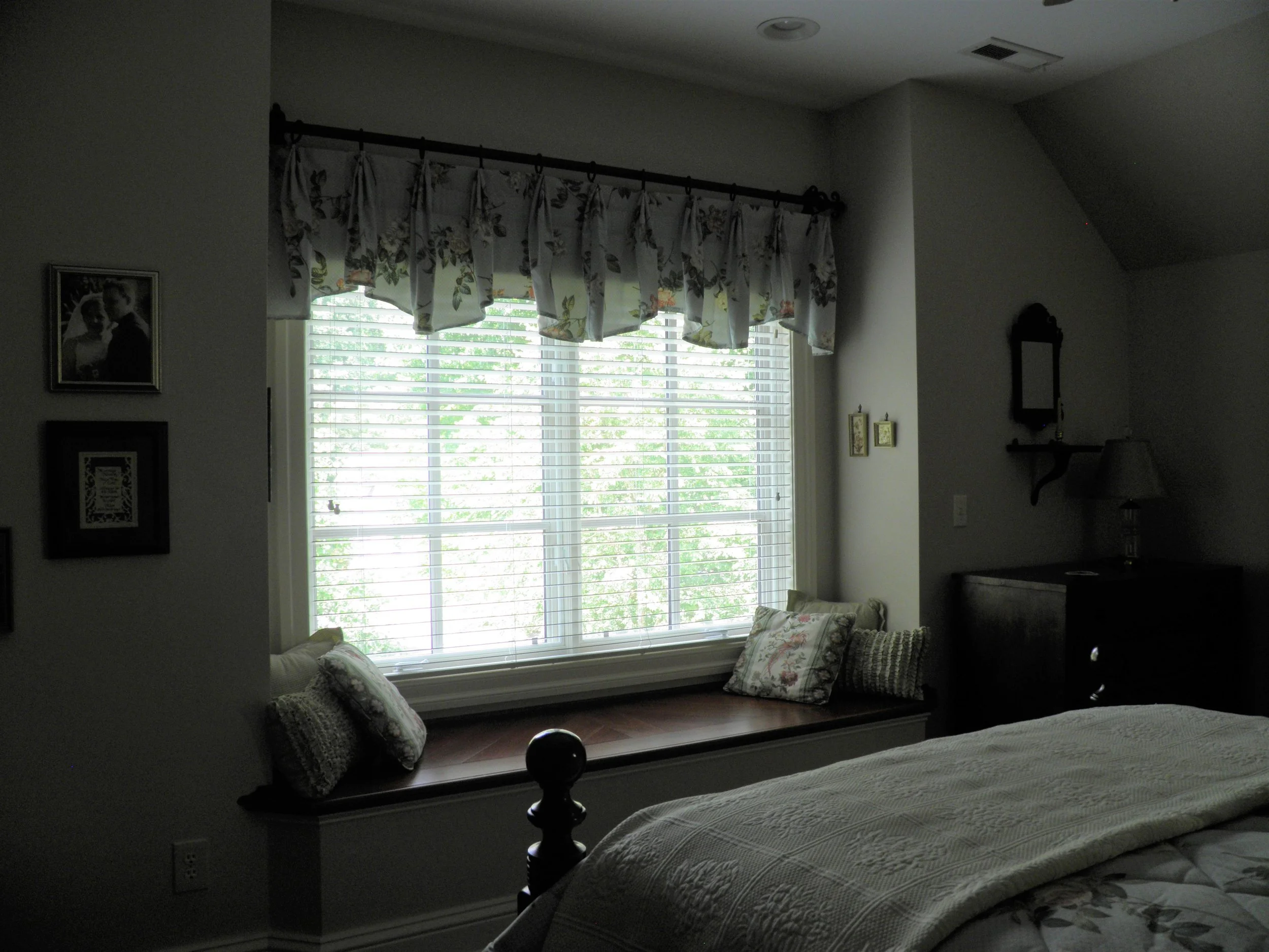 Attic bedroom with box bay and window seat.