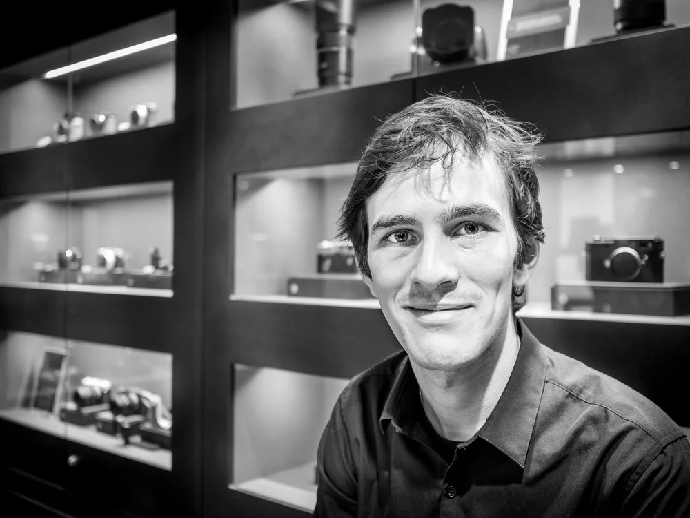 "Leica Staff Member Keeps Quiet about his Staff Discount"Olympus OM-D E-M5 + Olympus M.ZUIKO 17mm f/1.8ISO:&nbsp;800Aperture:&nbsp;f/1.8&nbsp;Shutter Speed: 1/100&nbsp;