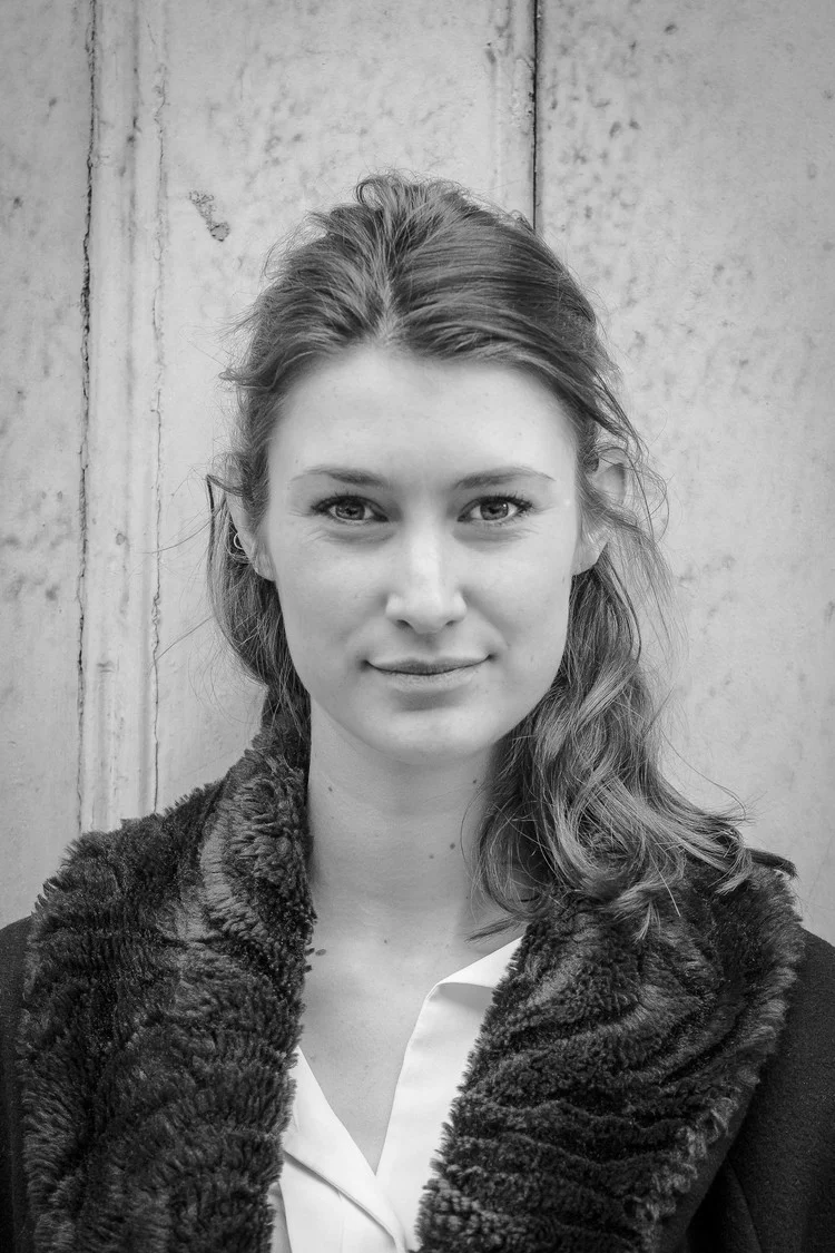 By putting my subject against a plain backdrop, I ensure that my subject is the only thing for my viewer to look at. Simple Framing.&nbsp;  Camera:&nbsp;Canon 7D Lens:&nbsp;85mm f/1.8 Aperture: f/4 Focal Length 85mm ISO: 1000 Shutter Speed: 1/400th