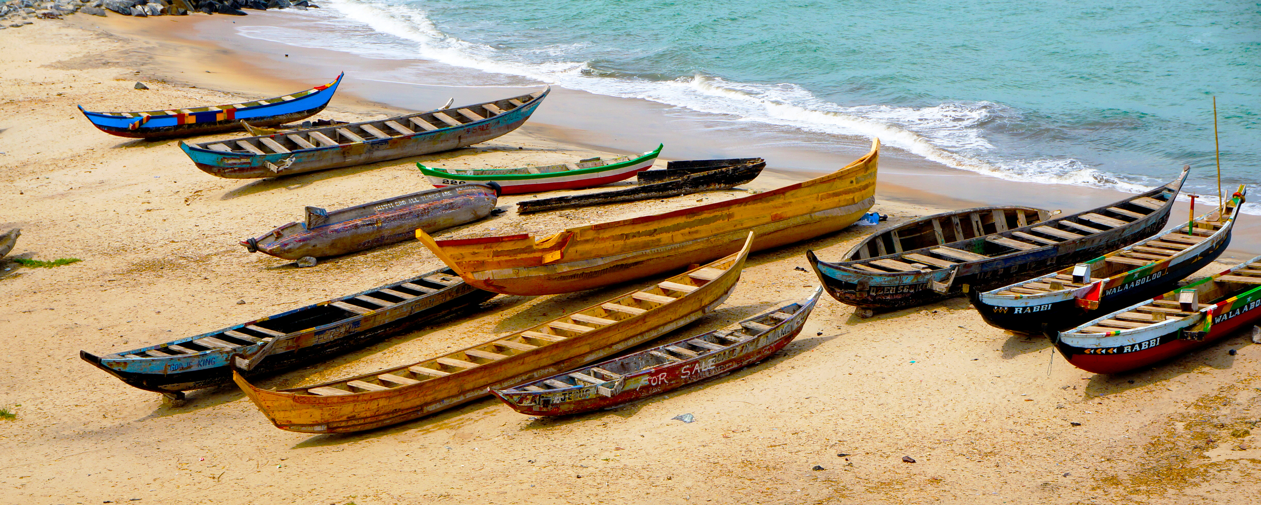 Boats at the Water's Edge at the Cape Coast Castle in Ghana