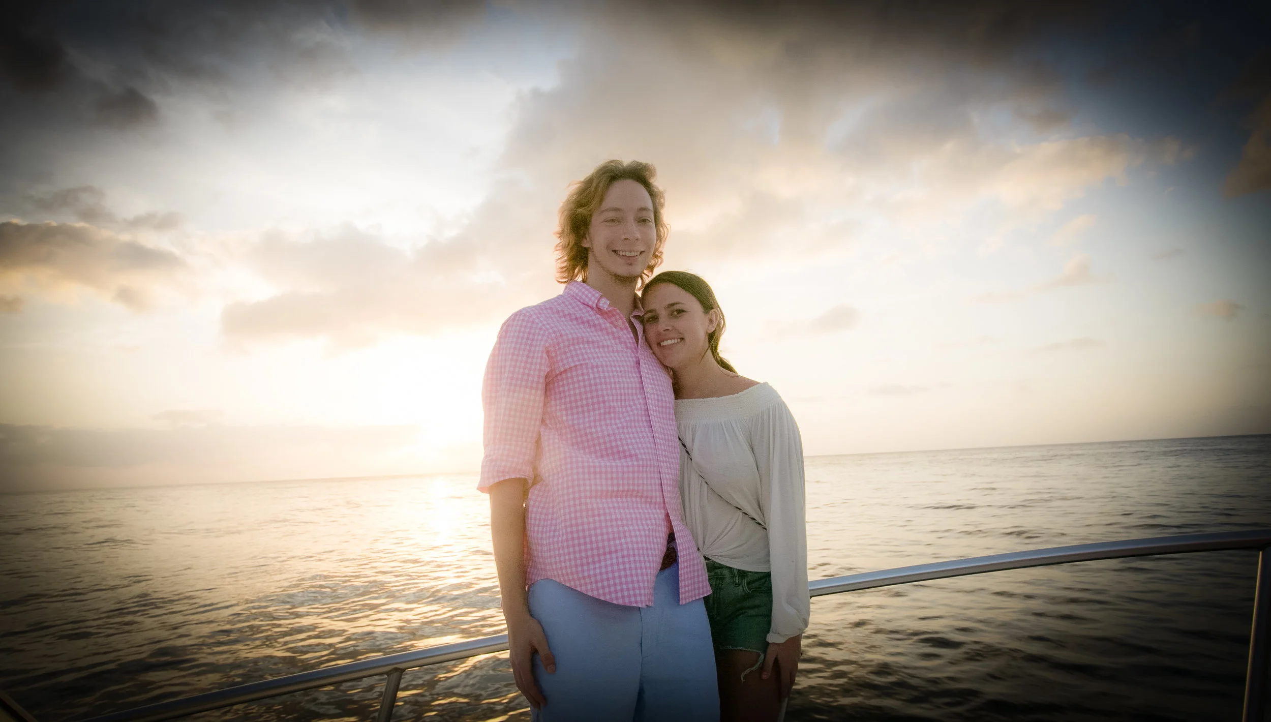 Not newly weds but enjoying vacation as well while sunset cruising and an adorable couple! Photography Courtesy of The Aisle Photography