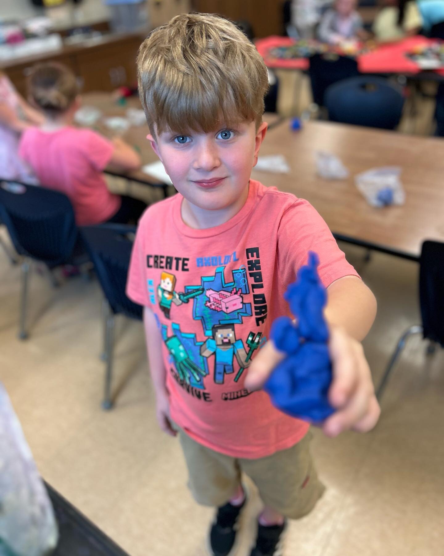 2nd grader Warren making a clay model of himself, making himself. 😍🤯