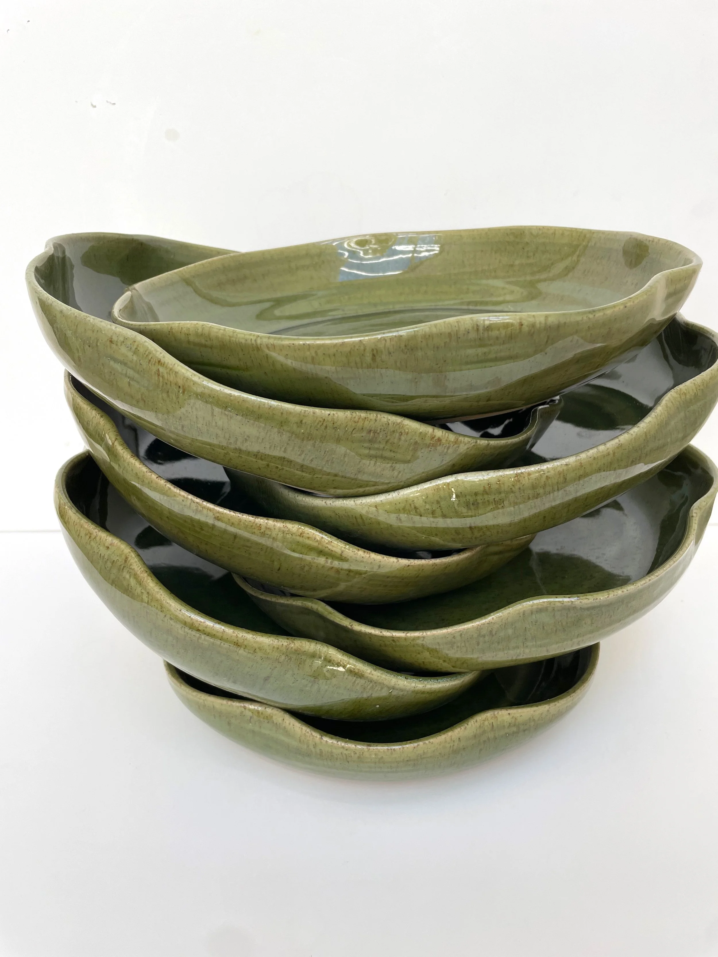 Ceramic wavy pasta bowl in grench green