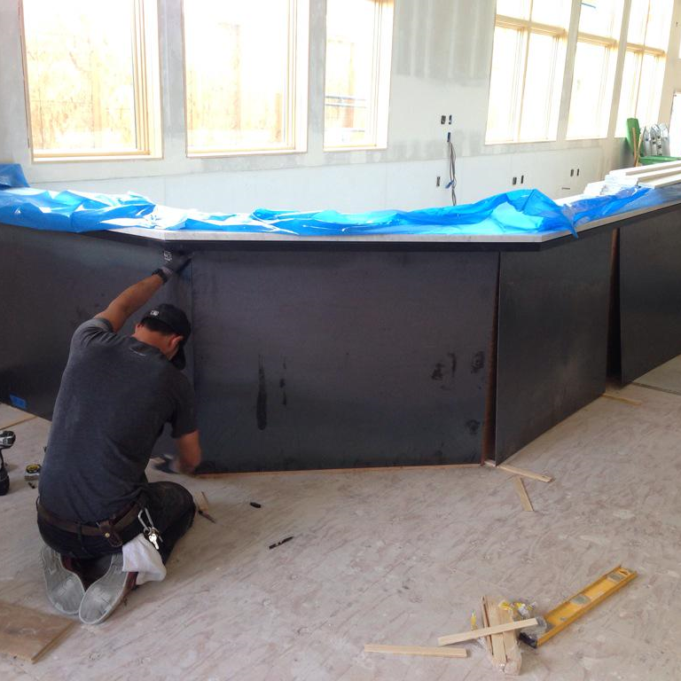 Marble & Steel Our full bar and open kitchen counteres are framed in powder coated black steel, and toped with white marble.