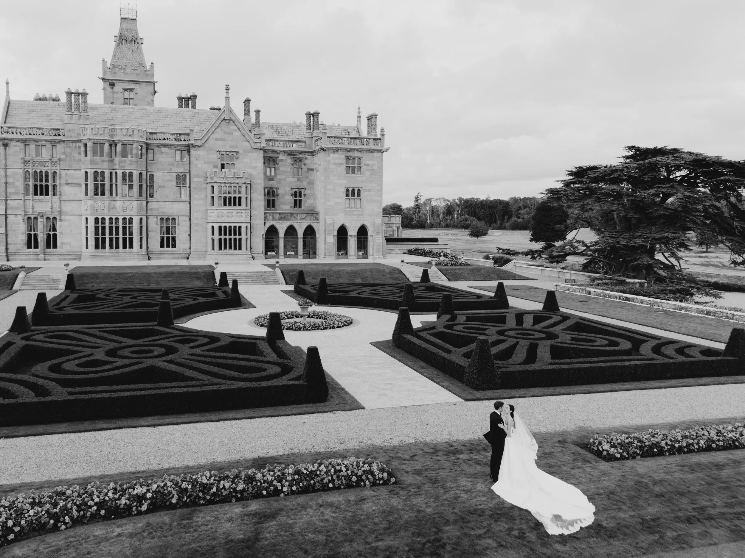 drone shot of wedding couple on the lawn at adare manor
