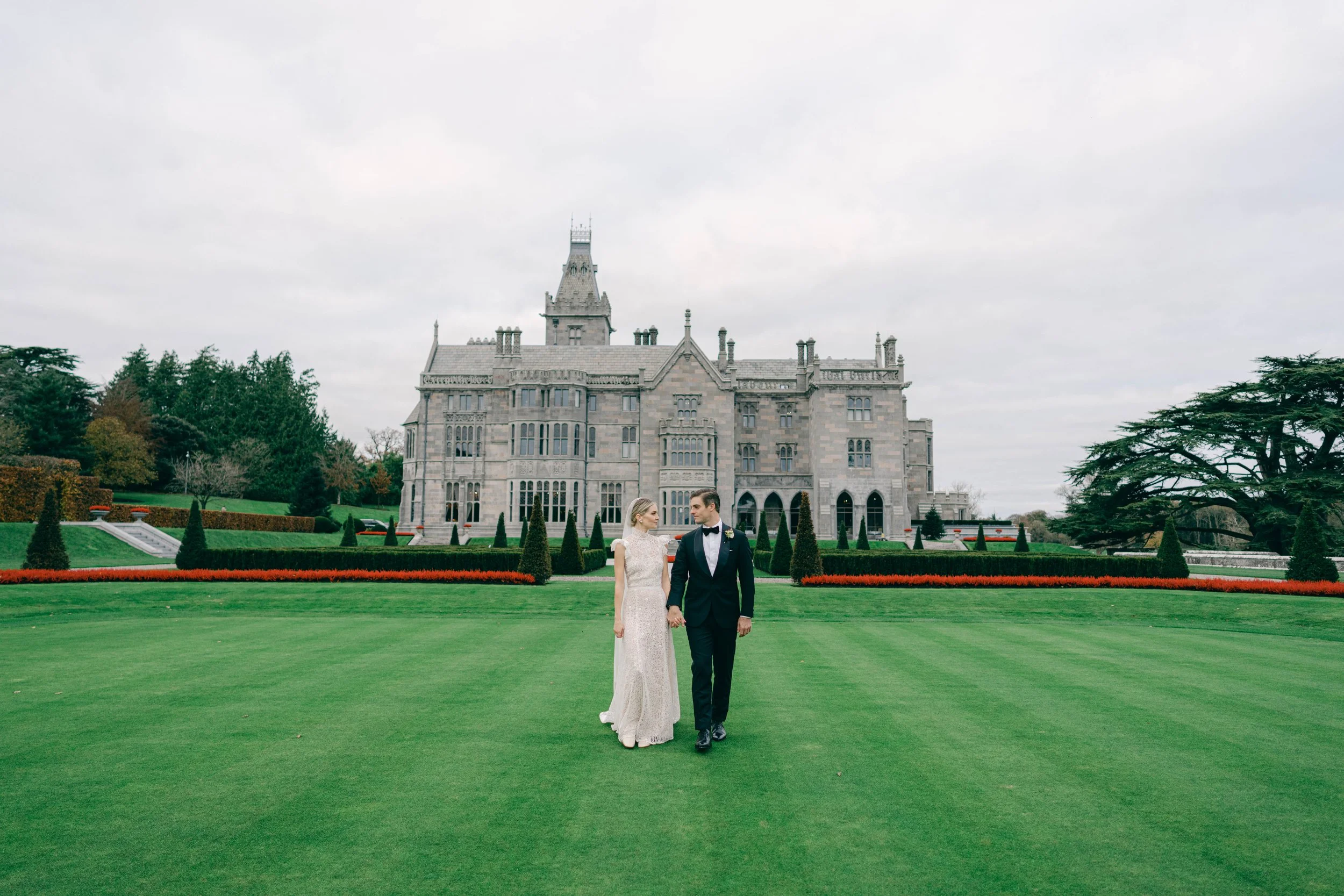 Bride and groom in front of the exquisite Adare Manor in Ireland