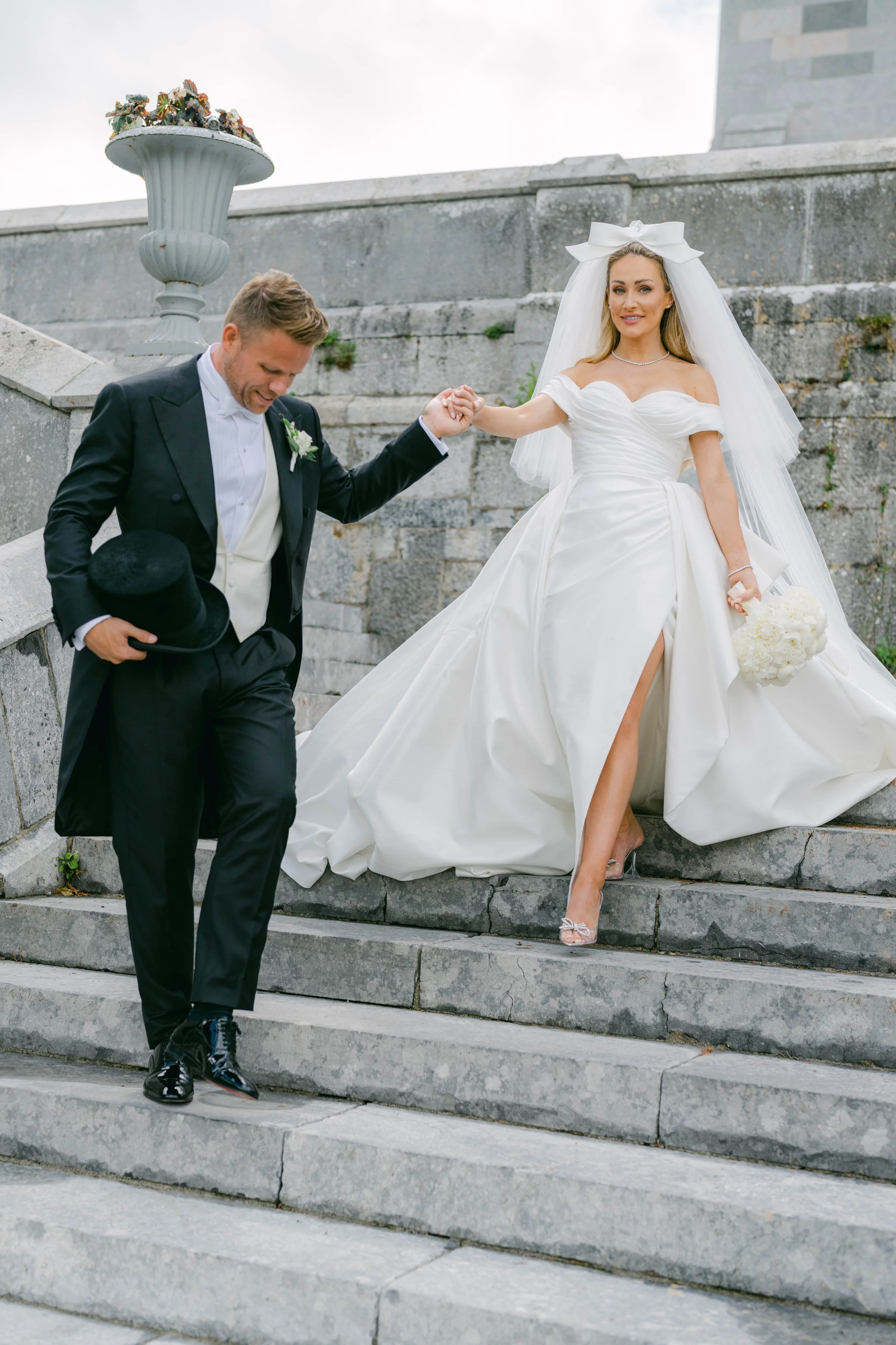 Maeve and Andrew on the steps at Adare Manor