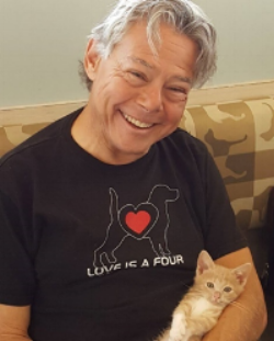 Bob Ferber with a rescue kitten Monty who was born with a leg deformity. Through rehabilitation that Bob provided, Monty now can play and run around like a normal cat.