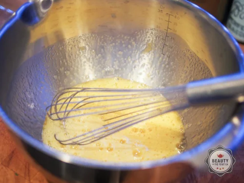 In a medium bowl whisk together whole eggs and yolks, salt, and remaining 2/3 cup sugar.While whisking, ladle small amount of milk into the egg mixture to temper the eggs. Whisk in remaining milk, one ladle at a time. It is important to temper the e…