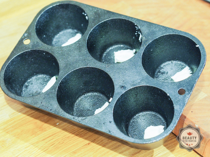 Melt butter into the cast iron corn bread baker.