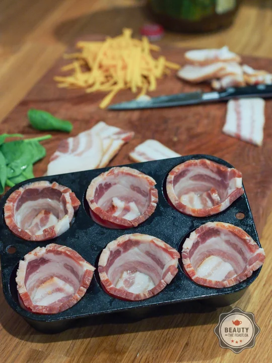 Line muffin tin with Bacon.