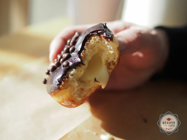 A luscious vahlrona glazed donut with decadent Bavarian cream.