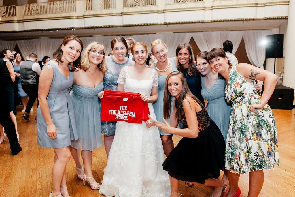 In the photo (L to R): Kate MacDuffie ('01), Mary Beth Alexander ('01), Rachel Besnoff ('04), Sarah Besnoff ('01), Callie Lefevre ('01), Gina Colaizzo ('01), Emma Powers ('01), Jessie Kalick ('01), Allie Hauptman ('01). Photo by Emily Wren Photography ; Instagram: @EmilyWrenPhoto.