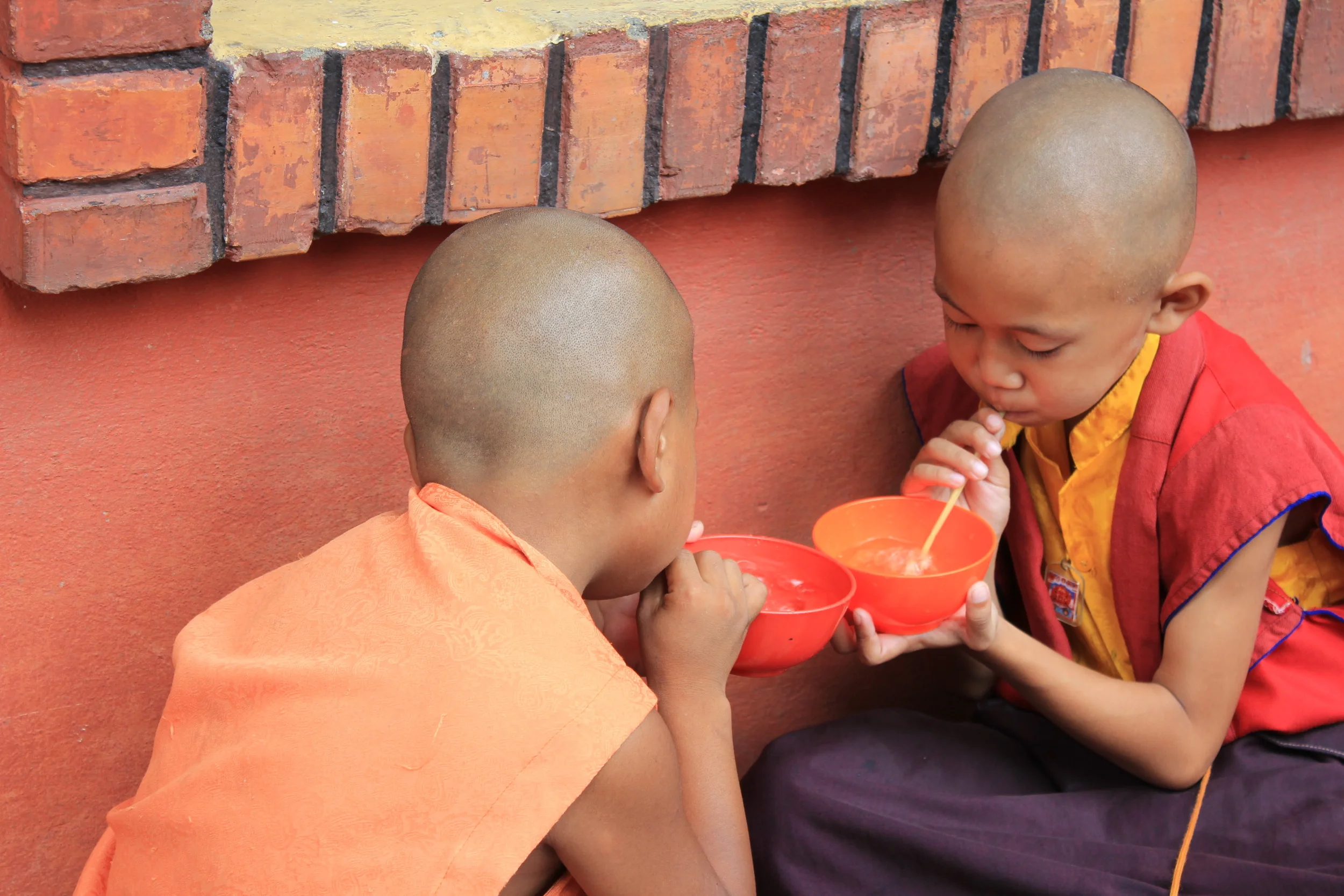 Small monks practicing circular breathing.