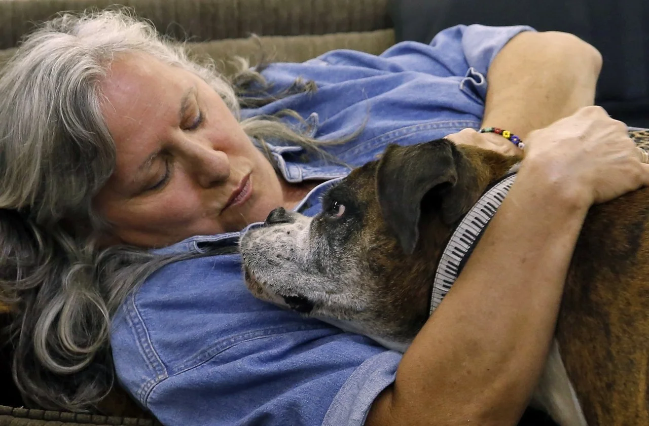  Cathy cuddles Haley while taking a short break during a hectic day. "Life is too short to be a workaholic," says Cathy. She tries to take at least a short rest every day. 