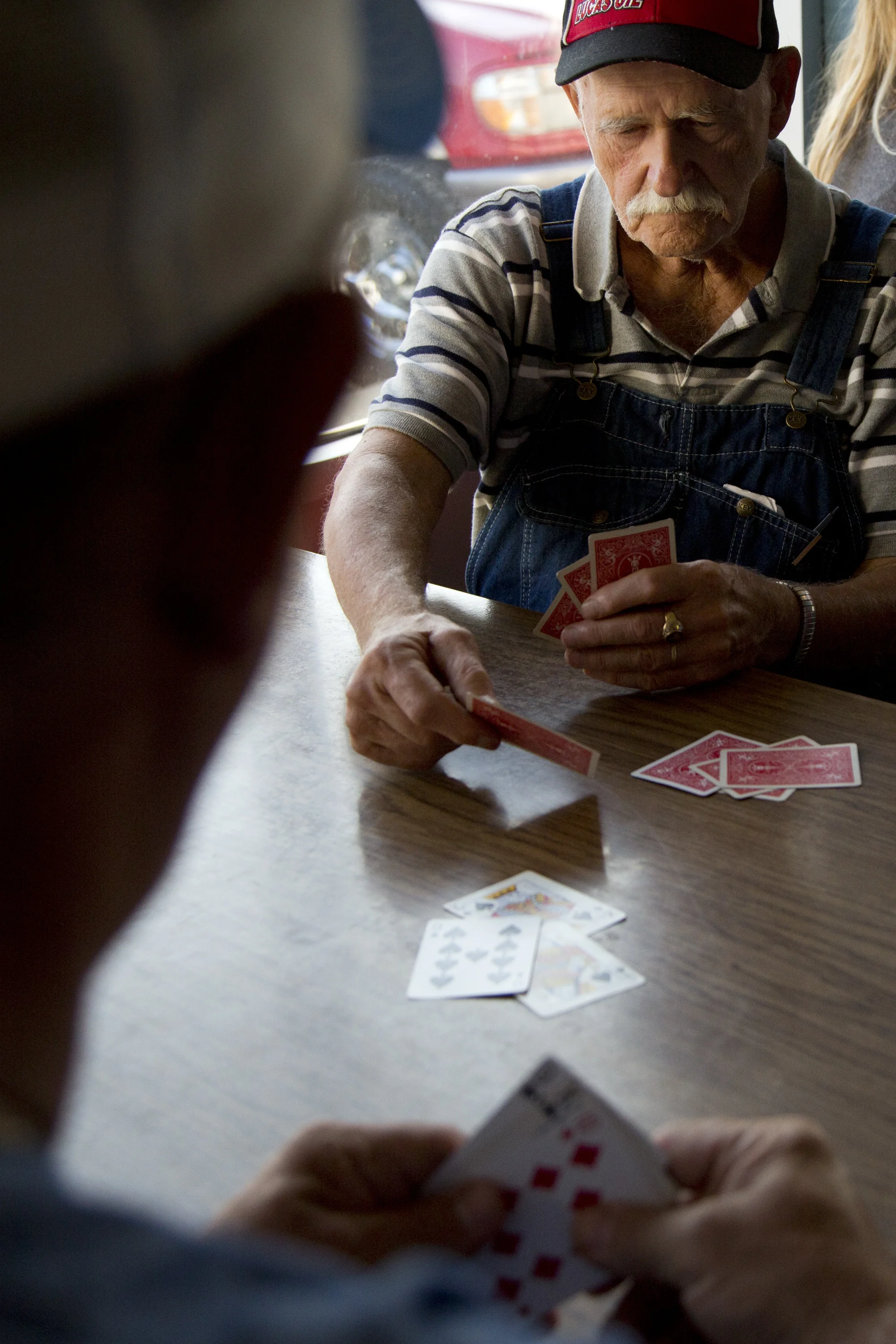 Herald Allen of Taswell, right, and Larry Ingle of Eckerty played Euchre during the tournament at Deb's Truck Stop in Birdseye on Thursday. The Birdseye Picnic begins Friday afternoon and continues through Saturday. 