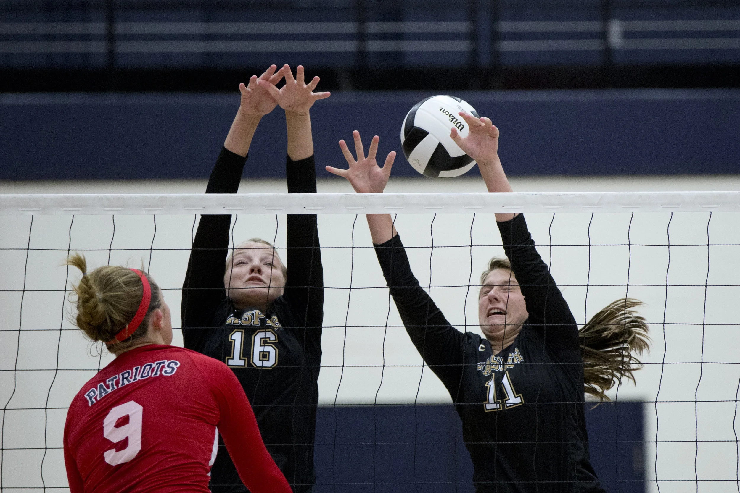 Jasper's Riley Merder and Jocelynn Morrow struggled to defend after Heritage Hills' Sydney Scherry spiked the ball over the net during the game at Heritage Hills High School in Lincoln City on Tuesday. The Patriots beat the Wildcats three sets to none. 