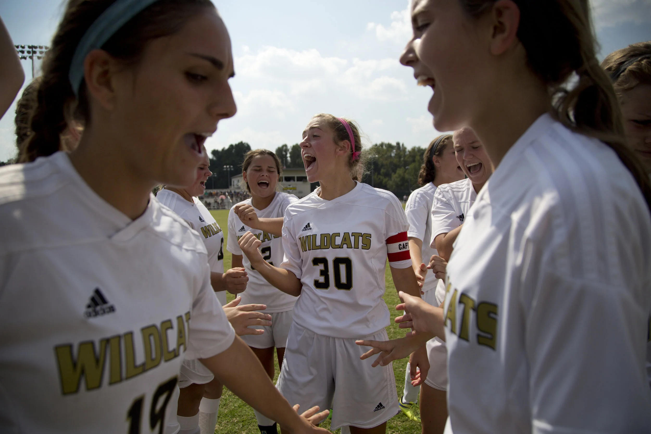 Jasper's Anna Charron, center, led the cheer in the halftime huddle during the game against Gibson Southern in Jasper on Saturday. Jasper lost 4-2. 