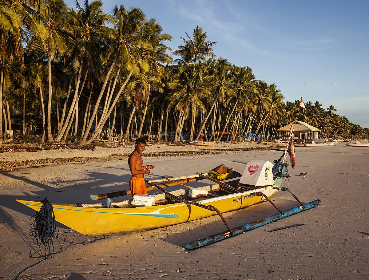 guy preparing his fishing boat