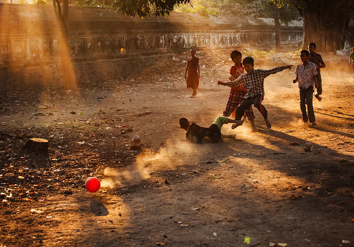 Kids playing soccer behind the Ein Daw Yar pagoda