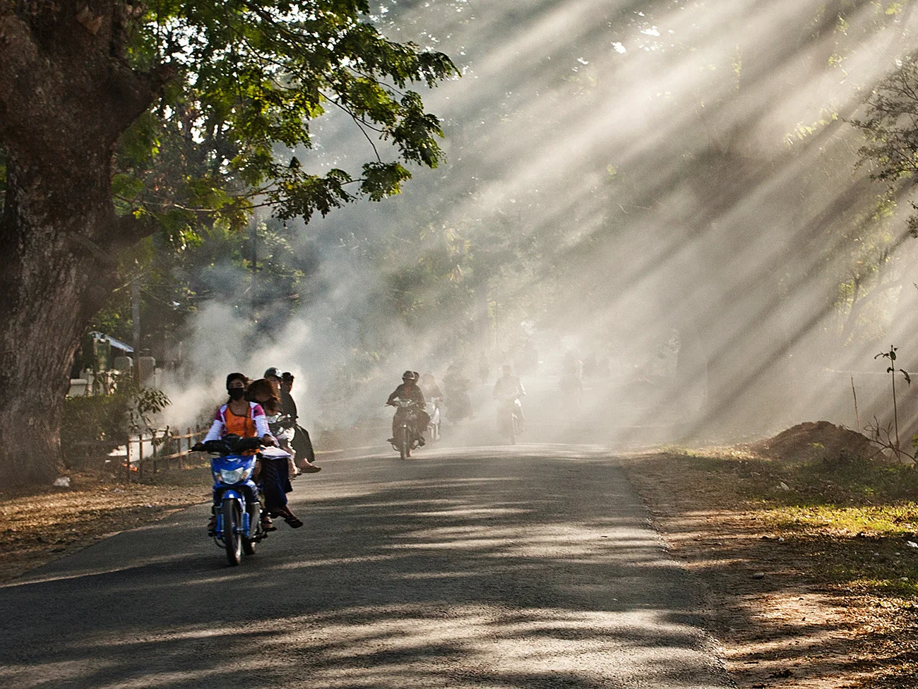 Awesome lighting conditions when they burn the trash along the road in Myitkyina