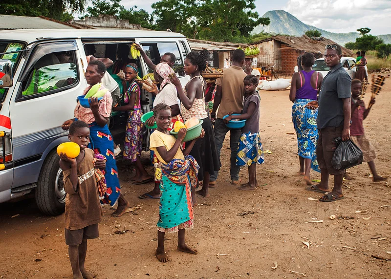 minibus from the border to Tete. Kid on the far right has a skewer of rats