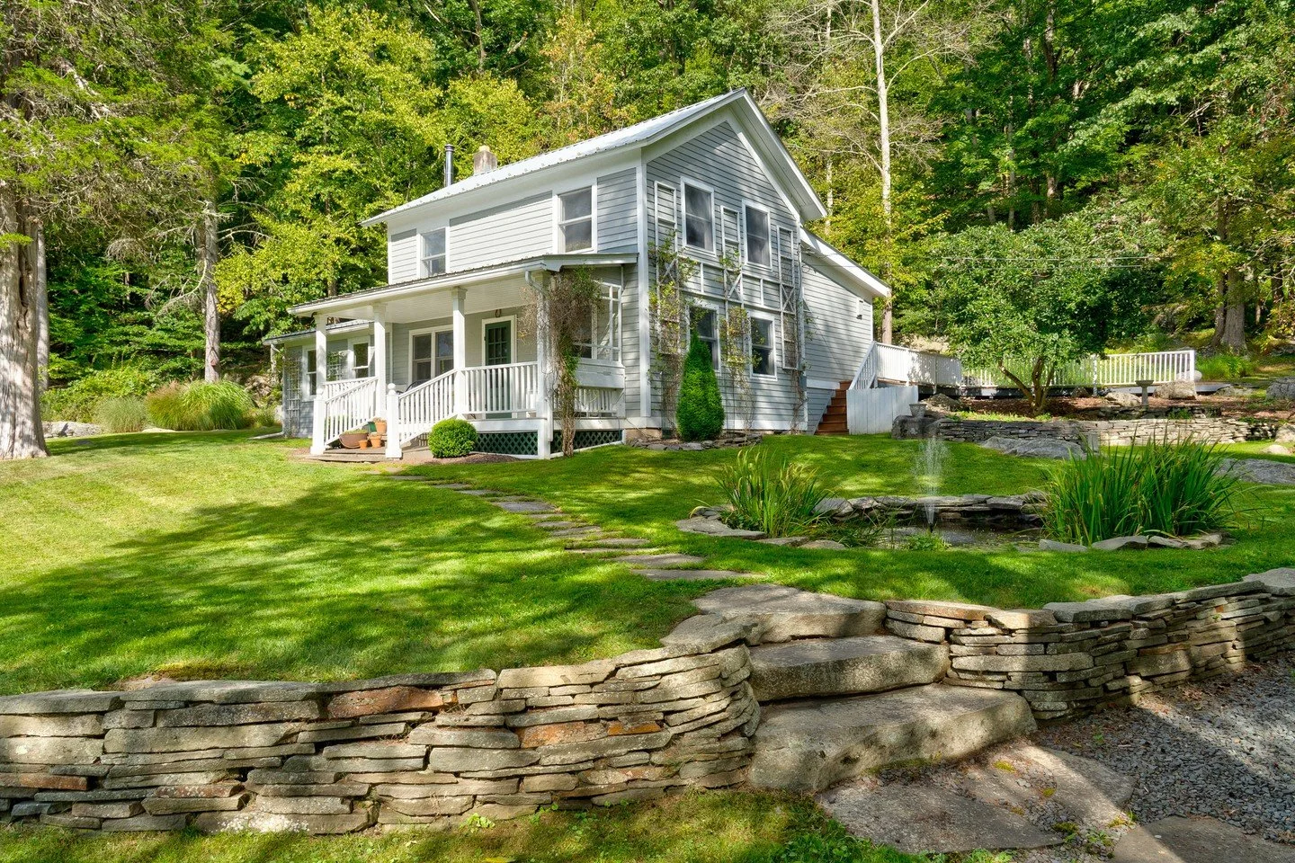 Set above the Lackawaxen River, this c.1900 farmhouse is all about easy country living and long views. From the front porch, the river and surrounding hills set the tone, shifting beautifully with the seasons.⁠
⁠
Inside, warm, light-filled rooms and 